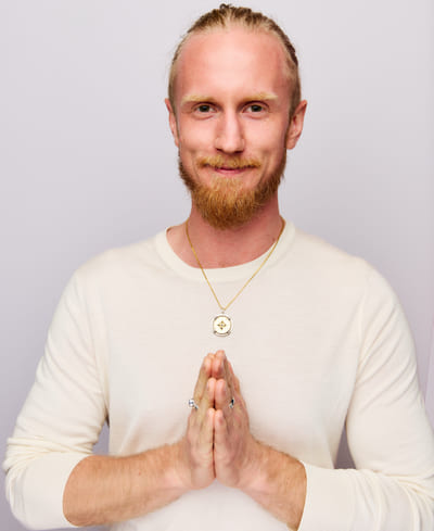Fredrik Brännlund, founder of Noa The Game Fredrik Brännlund with his hands together in front of his chest in atmanjali mudra